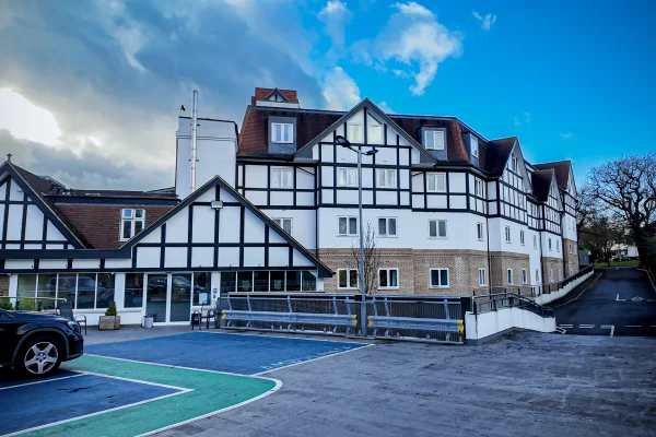 The grand Tudor-style exterior of Forest Place Nursing Home in Buckhurst Hill, Essex