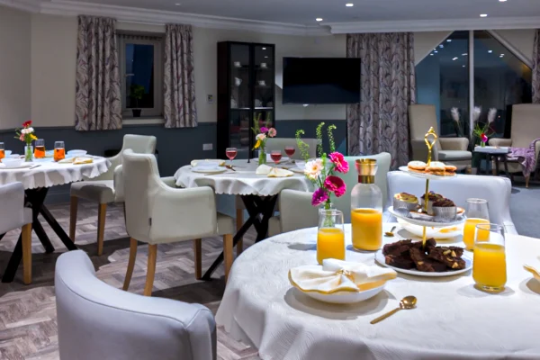 Beautifully set dining tables with fresh food
