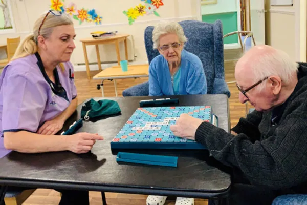 Residents enjoying a game of Scrabble in the communal area